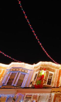 Christmas lights adorn the row houses 